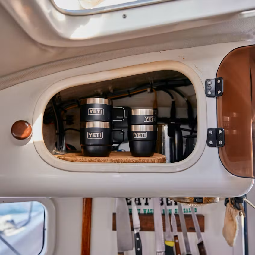 YETI tumblers in a storage compartment of a vehicle