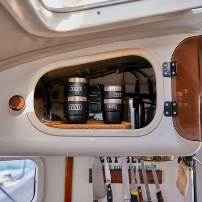 YETI tumblers in a storage compartment of a vehicle