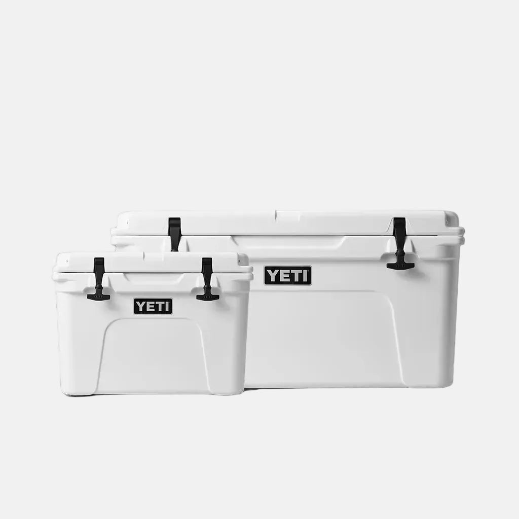 Two white YETI coolers of different sizes on a white background