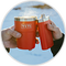 Red mug with a handle against a light blue background