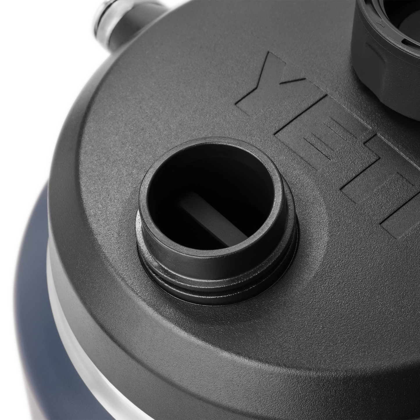 Close-up of a YETI brand lid on a white background